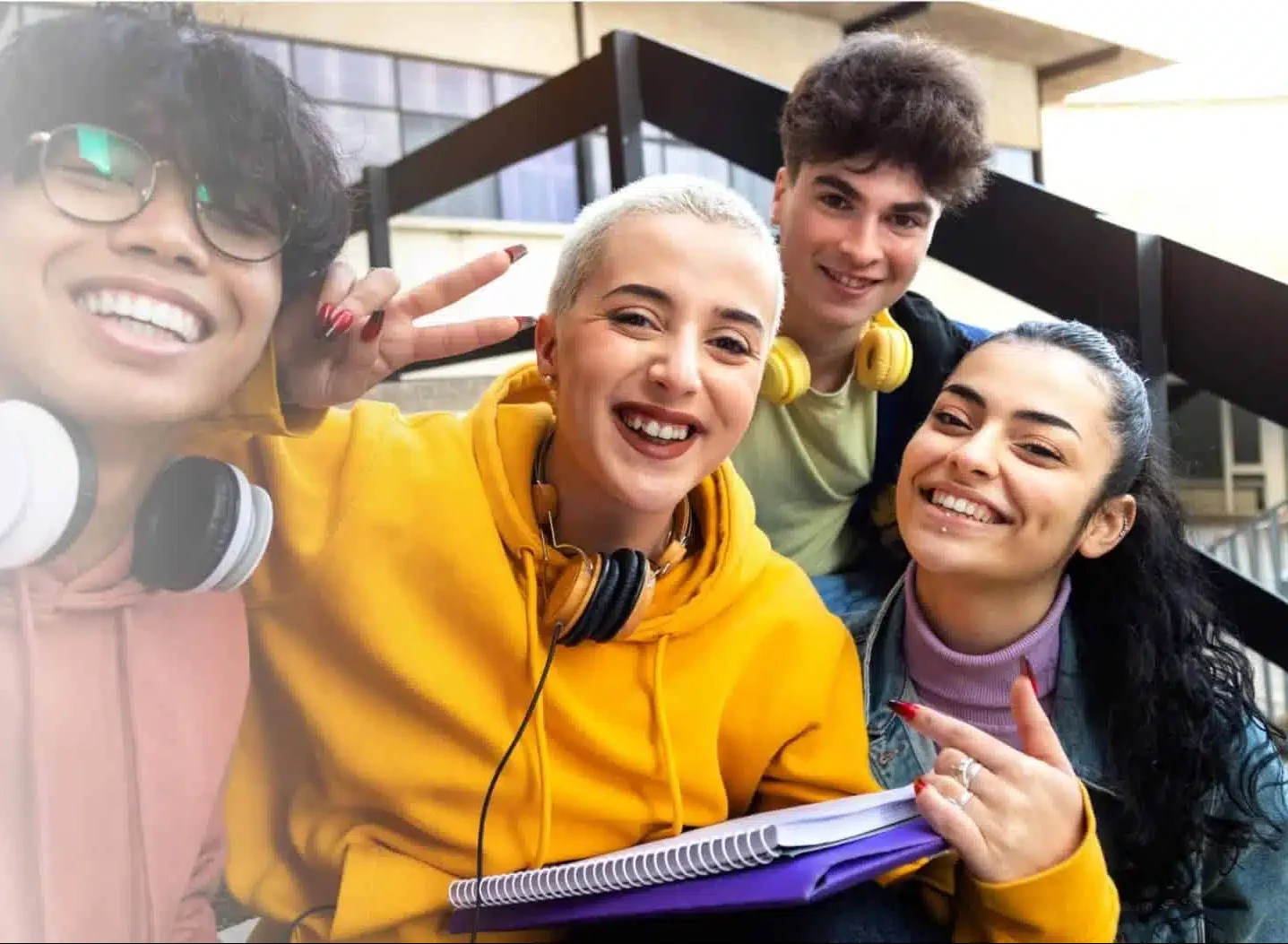 a diverse group of 4 college students smiling and laughing