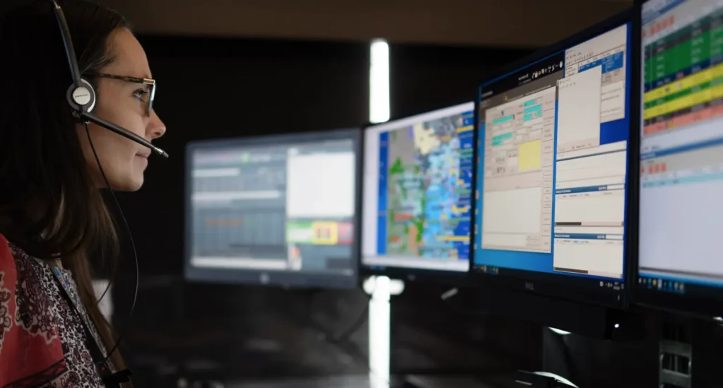female telecommunicator analyzing emergency data