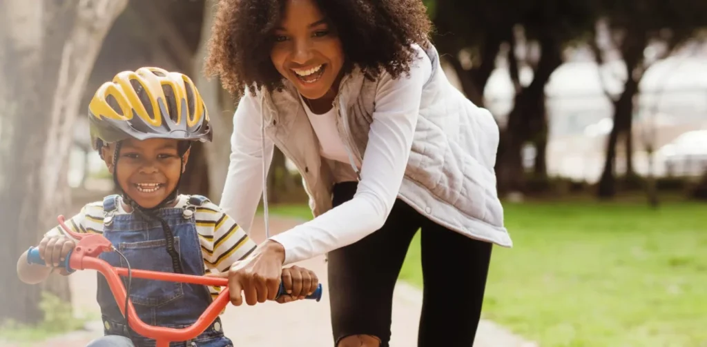 happy mother and son playing in the park