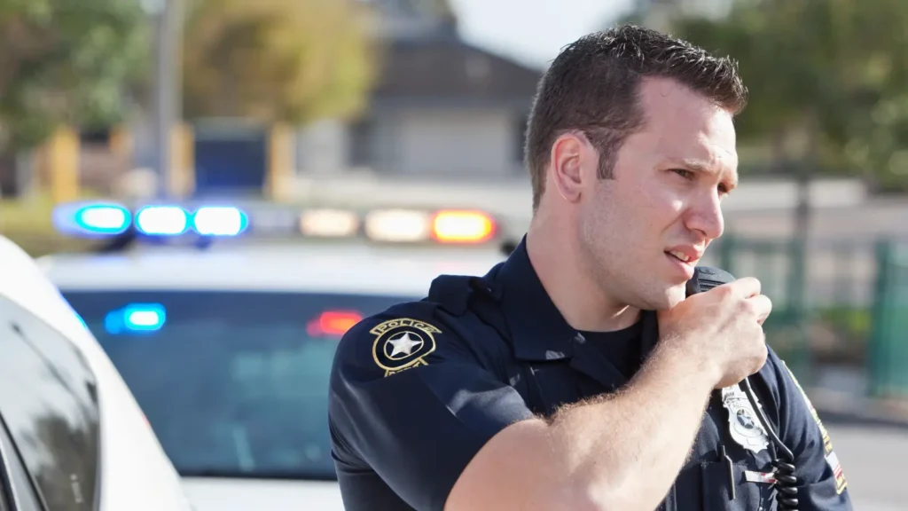 Police officer speaking over the radio