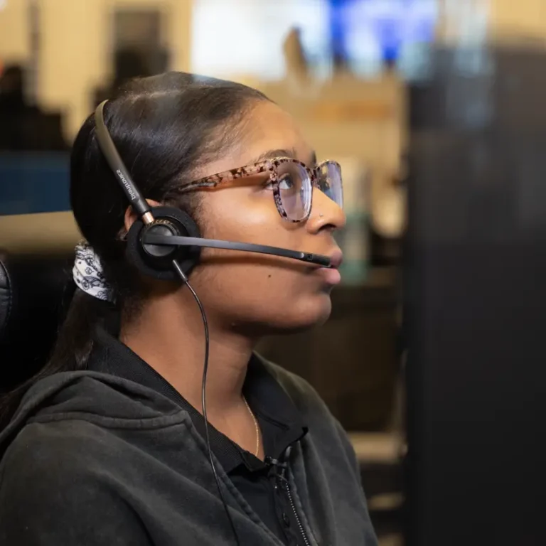 Telecommunicator working at desk